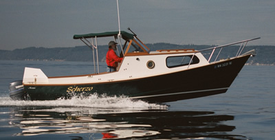 This custom wood boat, a 23' dory, is a fine small cruising boat